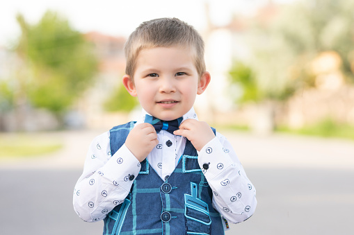 Young Boy Wearing Bow Tie Smiling