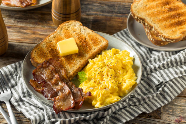 istock Homemade American Scrambled Egg Breakfast with Bacon 1224239804