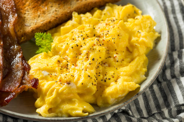 istock Homemade American Scrambled Egg Breakfast with Bacon 1224240926
