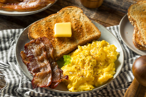 istock Homemade American Scrambled Egg Breakfast with Bacon 1224241195