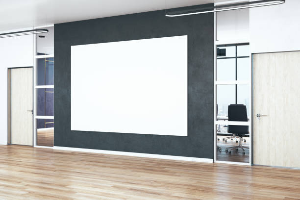 istock Modern office hall with blank poster on wall. 1224241280