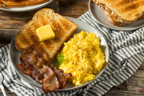 istock Homemade American Scrambled Egg Breakfast with Bacon 1224241515