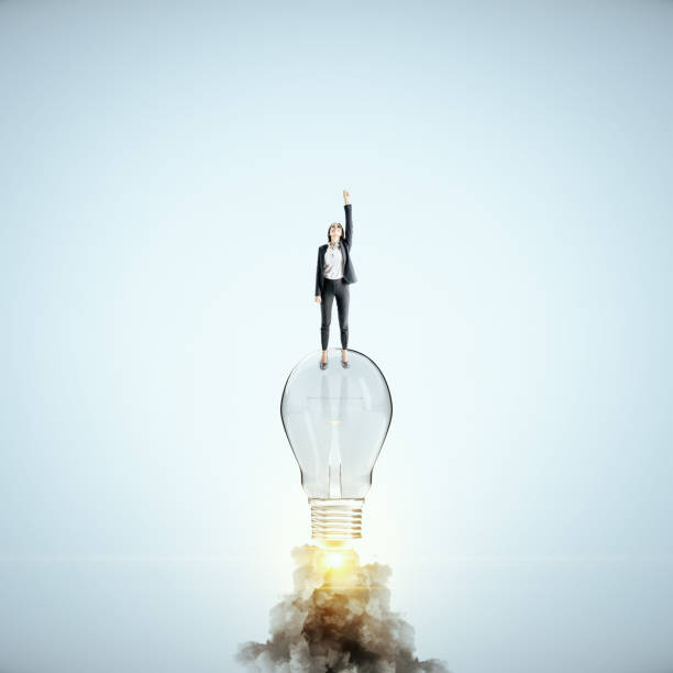 istock Businesswoman flying with launching lamp 1224242208