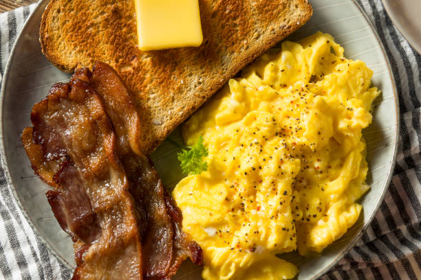 istock Homemade American Scrambled Egg Breakfast with Bacon 1224242236