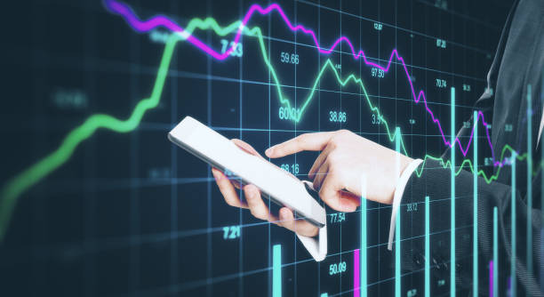 istock Businessman hand using digital tablet with business report 1224243586