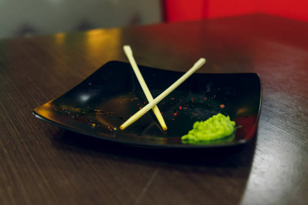 dusty plate after sushi rolls Asian kitchen restaurant table soft focus concept picture twilight lighting