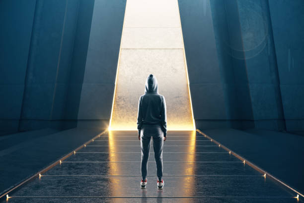 istock Hacker standing in contemporary futuristic gallery interior 1224243677