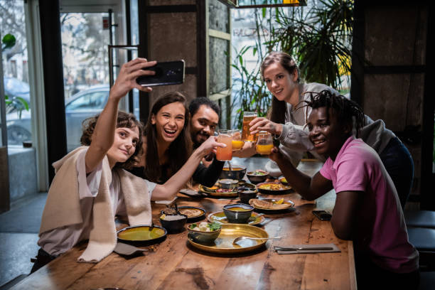 istock Group of students making a self-portrait with the phone camera 1224248249