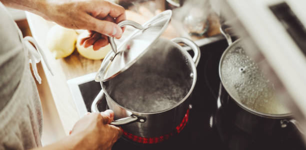 istock Man cooking fresh food at home 1224249122