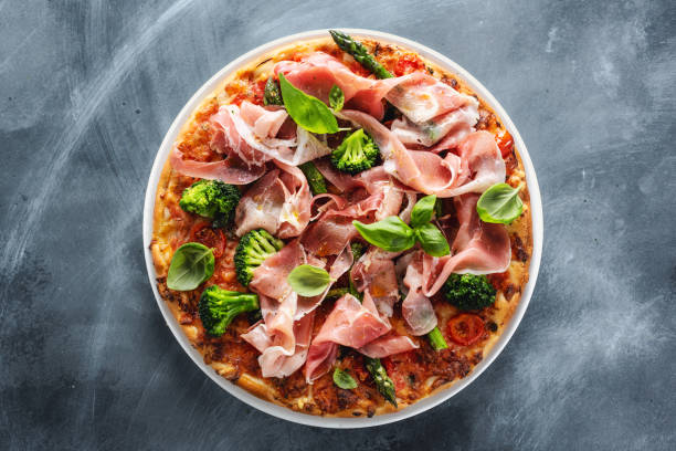 istock Italian classic pizza with meat and broccoli 1224250060