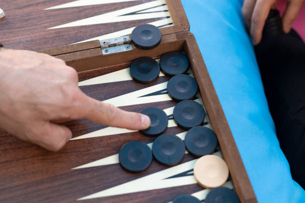 istock Two friends playing backgammon at home 1224250296