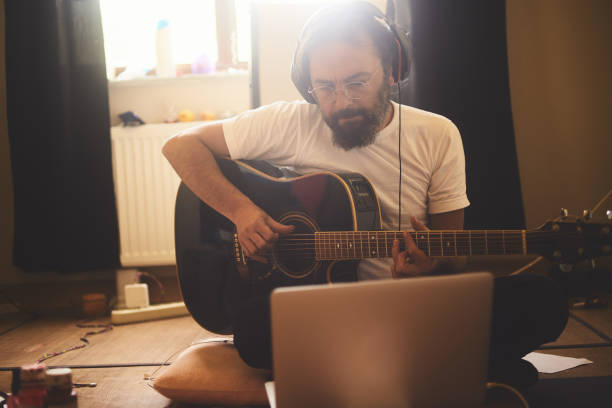 istock A man is recording music in the study room during quarantine days 1224251318