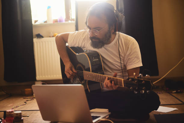 istock A man is recording music in the study room during quarantine days 1224251319