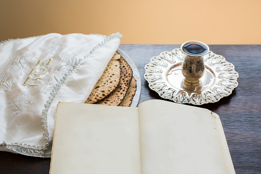 Passover wine, matza and haggadah.