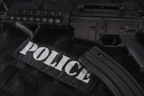 istock Special weapons and tactics team weapon, ammunitions and equipment on black uniform 1224255122