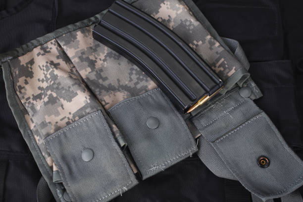 istock Special weapons and tactics team weapon, ammunitions and equipment on black uniform 1224255132
