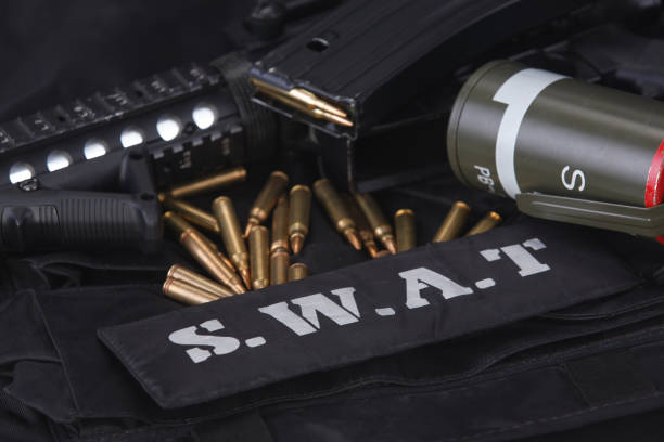 istock Special weapons and tactics team weapon, ammunitions and equipment on black uniform 1224255145