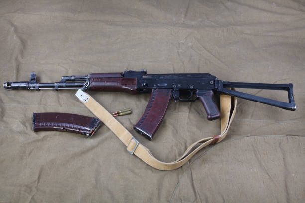 istock Kalashnikov AK 74 with ammunitions on canvas 1224256138
