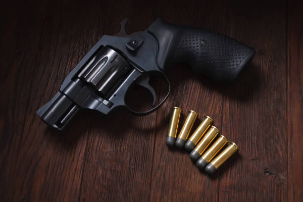 istock illegal handgun on wooden table 1224256239
