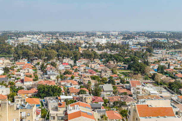 City with private houses and high-rise buildings on a background of sky City with private houses and high-rise buildings on a background of sky in summer daytime screen saver photos stock pictures, royalty-free photos & images