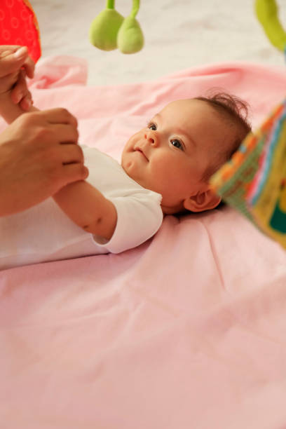 istock Newborn exercising with mother 1224263008