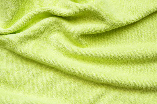 istock Green towel fabric texture surface close up background 1224263213