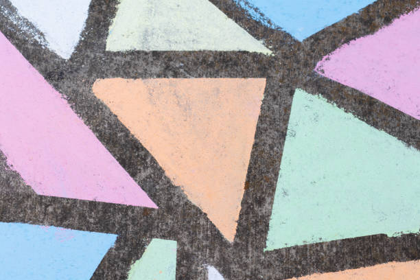 istock Brightly colored geometric shapes drawn in chalk along a side walk. 1224264613