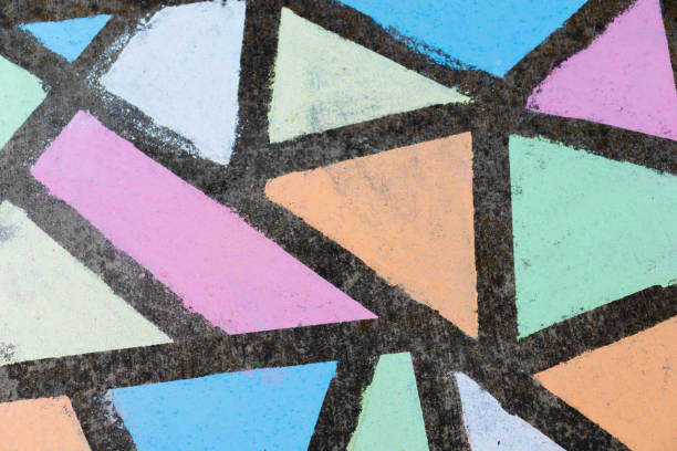istock Brightly colored geometric shapes drawn in chalk along a side walk. 1224264618