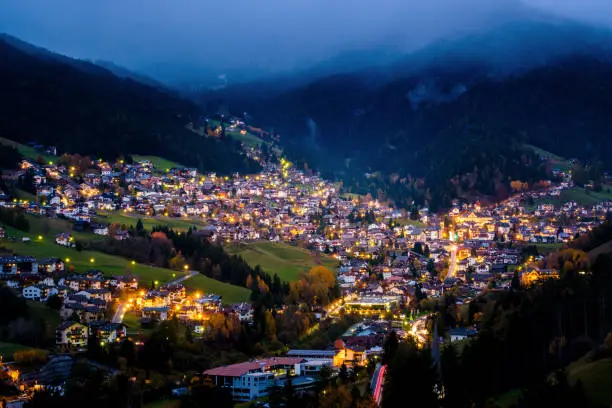 Ortisei cityscape during twilight in Val Gardena, Dolomites alps-Italy.