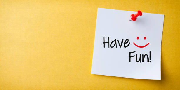 istock White Sticky Note With Have Fun And Red Push Pin On Yellow Background 1224269508