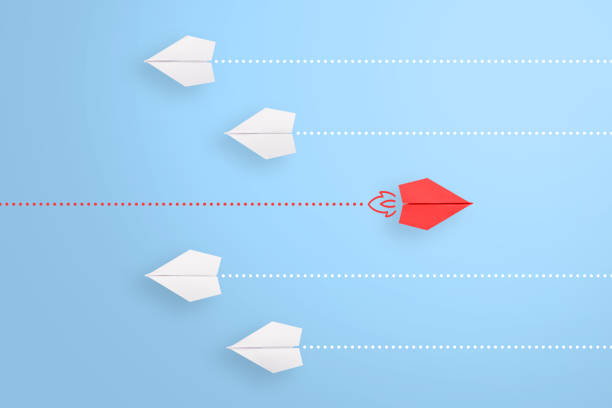 istock Change concepts with red paper airplane leading among white 1224269637