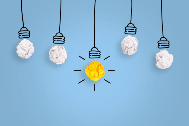istock Creative Idea Concepts with Light Bulb Crumpled Paper on Blue Background 1224269646