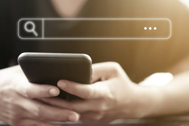 istock People hand using mobile phone or smartphone searching for information in internet online society web with search box icon and copyspace. 1224271335