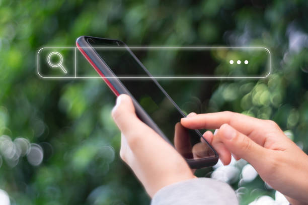 istock People hand using mobile phone or smartphone searching for information in internet online society web with search box icon and copyspace. 1224271391
