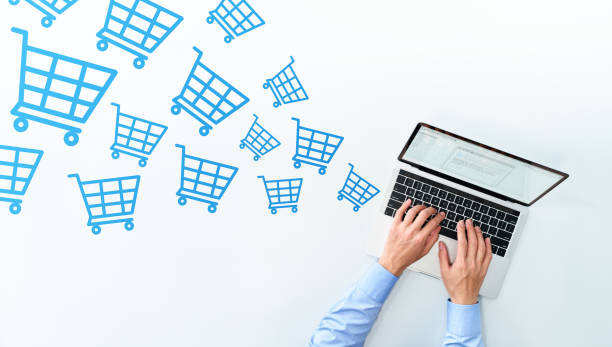 istock E-commerce concept. Receiving rush of orders. Top view of using laptop. 1224282301