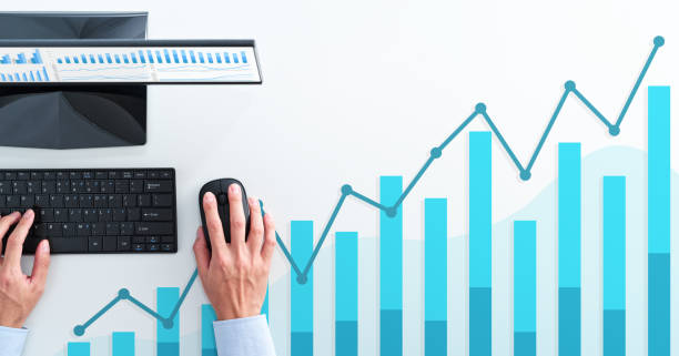 istock Business analysis and calculating. Top view of business man using spreadsheet. 1224282303