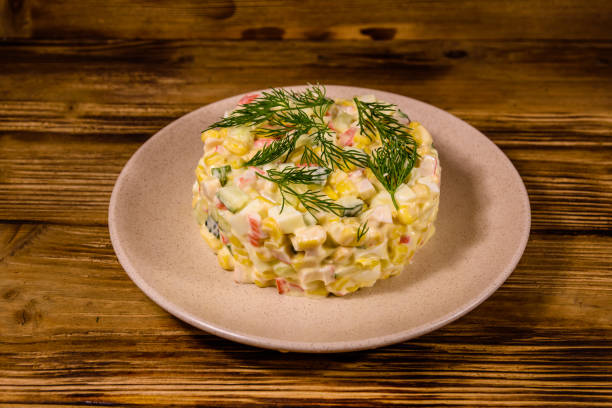istock Salad with crab sticks, boiled eggs and cucumbers on a ceramic plate 1224282434