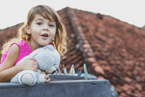Cute little girl embracing her new teddy bear.