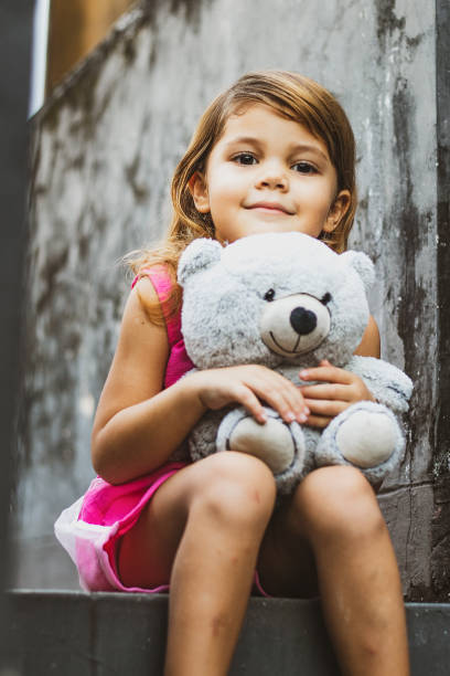 istock Young Girl with Teddy Bear 1224285594