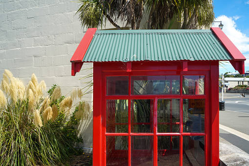 Traditional Red pay phone or telephone box , telephone booth - English style
