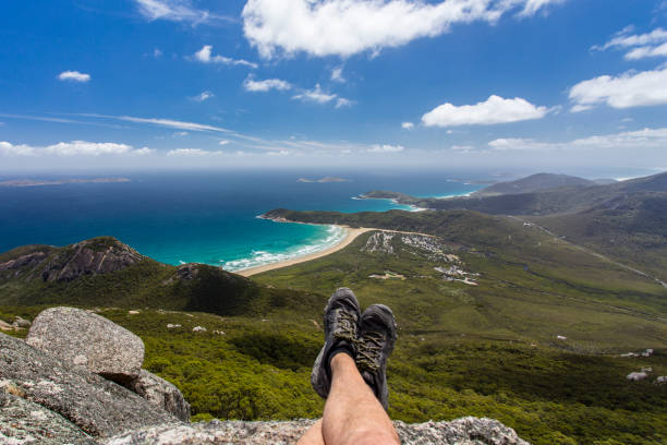 Hiker enjoying the view from the summit of Mount Oberon at Wilsons Promontory stock photo