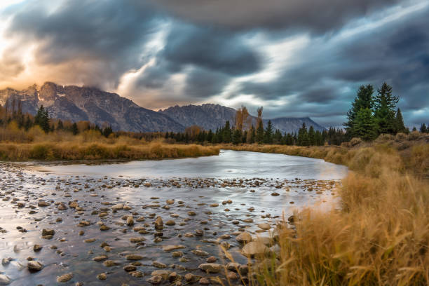 istock Cloudy skies and mountains in fall at sunrise 1224289920
