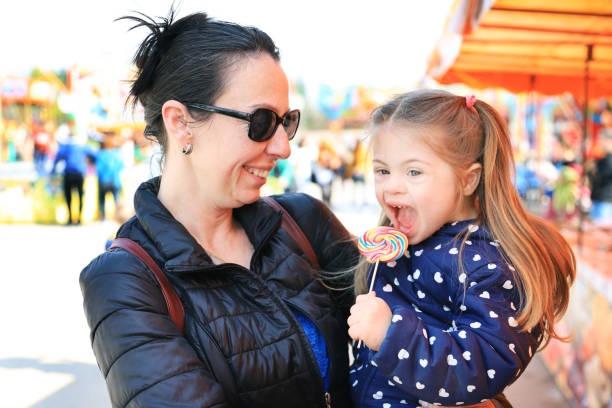 istock Mother and her kid in amusement park 1224291942
