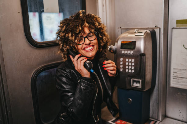 istock Beautiful woman in telephone booth 1224292897