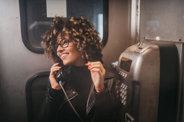 istock Beautiful woman in telephone booth 1224293211