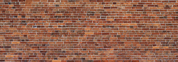 istock Old red Brick wall background. Wide panoramic view of masonry 1224293815
