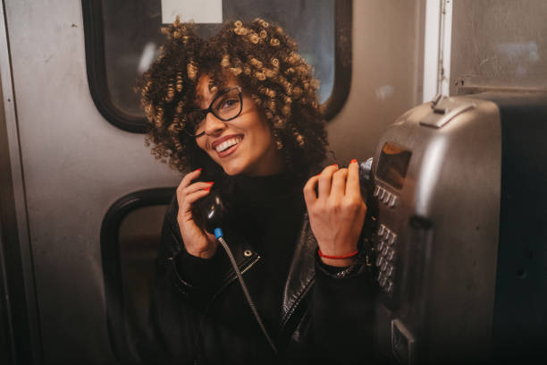 istock Beautiful woman in telephone booth 1224295340