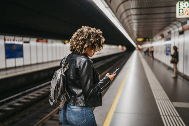 istock Young woman texting in a subway 1224295399