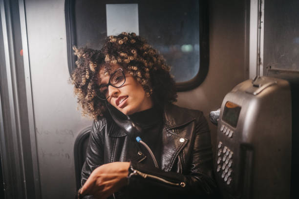 istock Beautiful woman in telephone booth 1224295455
