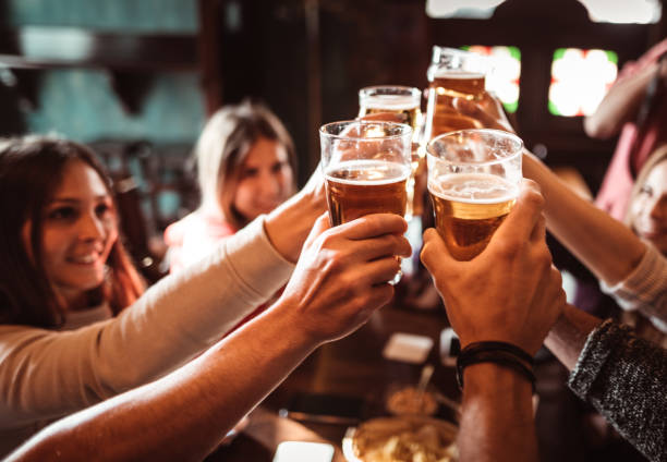 istock people talking and toasting in a pub with the beers 1224296602